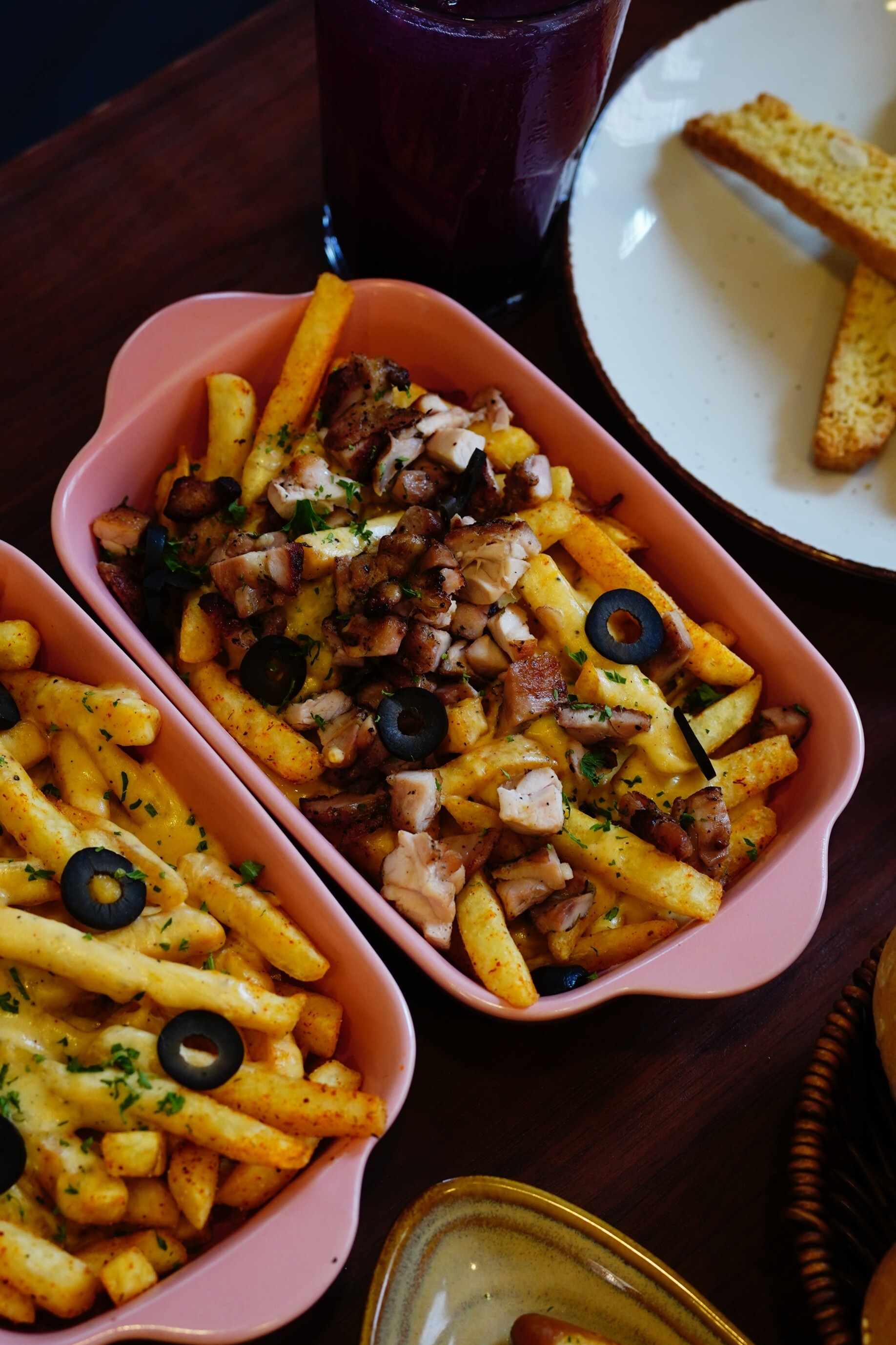 German-style loaded fries with grilled meat and black olives as starter